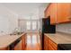 Bright kitchen view showcasing stainless appliances, and granite countertops with an open floor plan at 750 Howard Ave. # E, Myrtle Beach, SC 29577