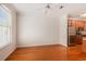 Open living area features hardwood floors, a ceiling fan and a modern kitchen at 750 Howard Ave. # E, Myrtle Beach, SC 29577