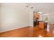 Spacious living area with hardwood floors, ceiling fan, and a modern kitchen at 750 Howard Ave. # E, Myrtle Beach, SC 29577