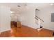 Open-concept living space features hardwood floors, modern kitchen, and staircase at 750 Howard Ave. # E, Myrtle Beach, SC 29577