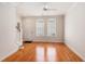 Bright living room with hardwood floors, ceiling fan, and staircase leading upstairs at 750 Howard Ave. # E, Myrtle Beach, SC 29577