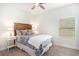 Bright bedroom with hardwood floors, a ceiling fan and a nicely decorated bed at 775 Harrison Mill St., Myrtle Beach, SC 29579
