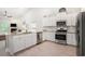 Well-equipped kitchen featuring granite counters, stainless steel appliances and view to adjacent living room at 775 Harrison Mill St., Myrtle Beach, SC 29579
