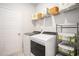Functional laundry room with modern washer and dryer, storage shelves, and clean design at 775 Harrison Mill St., Myrtle Beach, SC 29579