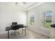 Bright office with a desk, natural light streaming through windows, and hardwood style flooring at 775 Harrison Mill St., Myrtle Beach, SC 29579