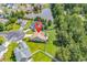 Aerial view of a home with a large backyard, patio, and a lake in a beautiful neighborhood at 824 Dunoway Ct., Myrtle Beach, SC 29579