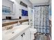 Nautical themed bathroom with white vanity, blue accents, and a shower-tub combo at 824 Dunoway Ct., Myrtle Beach, SC 29579