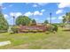 Inviting community entrance with a brick sign, manicured landscaping, and lush green grass at 824 Dunoway Ct., Myrtle Beach, SC 29579