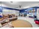 Spacious garage converted into a living area with a comfortable leather sofa at 824 Dunoway Ct., Myrtle Beach, SC 29579