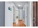 Inviting hallway featuring hardwood floors and blue walls, leading to various rooms at 824 Dunoway Ct., Myrtle Beach, SC 29579