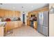 Spacious kitchen featuring stainless steel appliances, tile flooring and wood cabinets at 824 Dunoway Ct., Myrtle Beach, SC 29579