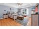 Comfortable main bedroom with ceiling fan, wood floors, and natural light at 824 Dunoway Ct., Myrtle Beach, SC 29579