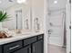 Modern bathroom features a vanity with stylish fixtures, a large mirror, and a tub with a shower at 866 Fowler Rd., Conway, SC 29526