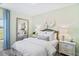 Serene bedroom with soft green walls, plush bedding, and a large mirror, creating a tranquil retreat at 866 Fowler Rd., Conway, SC 29526