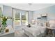 Light and airy bedroom with white walls, plush bedding, and a large window overlooking a green lawn at 866 Fowler Rd., Conway, SC 29526