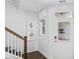 Bright entryway featuring shiplap walls, wood-look floors, and a staircase, offering a welcoming introduction to the home at 866 Fowler Rd., Conway, SC 29526