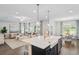 Spacious kitchen with a large island, stainless steel appliances, an adjacent living room, and dining area at 866 Fowler Rd., Conway, SC 29526