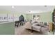 Relaxing living room with comfortable seating, game table, and large windows with a view at 866 Fowler Rd., Conway, SC 29526