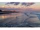 Scenic beach view at sunset with city buildings on the horizon at 901 West Port Dr. # 305, North Myrtle Beach, SC 29582