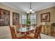 A formal dining area featuring a glass table, seating for six, and neutral walls with decor at 901 West Port Dr. # 305, North Myrtle Beach, SC 29582