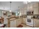 The kitchen features granite countertops, stainless steel appliances, and ample cabinet space at 901 West Port Dr. # 305, North Myrtle Beach, SC 29582