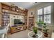 Cozy living room features built-in bookshelves and media center, providing ample storage and entertainment space at 901 West Port Dr. # 305, North Myrtle Beach, SC 29582