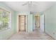 Green bedroom with window and closet ready for personalization and customization at 910 N Dogwood Dr., Surfside Beach, SC 29575