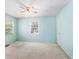 Calming bedroom with soft blue walls, lots of natural light, and carpeted floors at 910 N Dogwood Dr., Surfside Beach, SC 29575