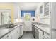 Kitchen with white cabinets, stainless steel appliances, and lots of counter space at 910 N Dogwood Dr., Surfside Beach, SC 29575