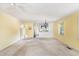 Spacious living room with ceiling fan, and adjacent kitchen area at 910 N Dogwood Dr., Surfside Beach, SC 29575