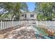 Backyard pool surrounded by white picket fence and mature trees at 910 N Dogwood Dr., Surfside Beach, SC 29575