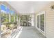 Spacious screened-in porch with ample natural light and views at 910 N Dogwood Dr., Surfside Beach, SC 29575