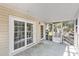 An outdoor patio with natural light ready for entertaining or relaxation at 910 N Dogwood Dr., Surfside Beach, SC 29575