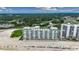 Wide aerial view of oceanfront condos and meticulously manicured lawns at 9400 Shore Dr. # 617, Myrtle Beach, SC 29572