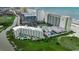 Aerial view of beachfront condos featuring an outdoor pool and immaculate lawns at 9400 Shore Dr. # 617, Myrtle Beach, SC 29572