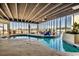 Bright indoor pool area with floor to ceiling windows and views at 9400 Shore Dr. # 617, Myrtle Beach, SC 29572