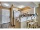 Charming kitchen featuring granite countertops and bar seating at 9400 Shore Dr. # 617, Myrtle Beach, SC 29572