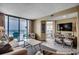 Relaxing living room with balcony offering stunning ocean views and beach access at 9400 Shore Dr. # 617, Myrtle Beach, SC 29572