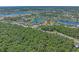 Aerial view of a community featuring wooded areas, homes, and a lake at 945 Waterbridge Blvd., Myrtle Beach, SC 29579