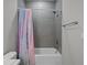 Bathroom featuring gray subway tile, a shower/tub combination, and a colorful shower curtain at 945 Waterbridge Blvd., Myrtle Beach, SC 29579