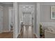 Bright hallway with wood floors leading to various rooms in the home at 945 Waterbridge Blvd., Myrtle Beach, SC 29579