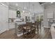 Beautiful kitchen with stone-clad island, stainless steel appliances, and pendant lighting at 945 Waterbridge Blvd., Myrtle Beach, SC 29579