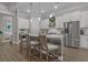 Beautiful kitchen with white cabinets, a stone island, and stainless steel appliances at 945 Waterbridge Blvd., Myrtle Beach, SC 29579