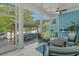 Screened-in patio with seating, a ceiling fan, and a view of the backyard gazebo at 945 Waterbridge Blvd., Myrtle Beach, SC 29579