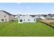 Well-manicured backyard featuring a new home with a patio and spacious grassy area at 1004 Kinness Dr., Conway, SC 29527
