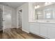Bright bathroom with double vanity, white cabinets, and view of the walk-in shower at 1004 Kinness Dr., Conway, SC 29527