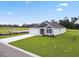 Attractive single-story home with a well-kept lawn and long driveway leading to the attached garage at 1004 Kinness Dr., Conway, SC 29527