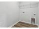 Practical laundry area with hookups, shelving, and vinyl floors ready for appliances at 1004 Kinness Dr., Conway, SC 29527