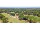 Aerial view showcasing a lush green golf course with sand traps and mature trees in a scenic setting at 10071 Kings Rd., Myrtle Beach, SC 29572