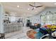 Open concept living space with a kitchen, white cabinets, and lots of natural light at 10071 Kings Rd., Myrtle Beach, SC 29572